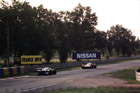 A Toyota and a Nissan head away from Arnage on the way back to the Porsche Curves.