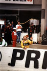 Derek Bell emerges from the Harrods McLaren pit and immediately spots his old mate Aysedasi standing in the rain on the tribunes - what a splendid chap he is!