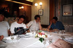 The picture shows Ian, Jamie, Mark and Martin deciding what to order in Le Belinois at Monce-en-Belin. Note Ian's t-shirt - which he had to borrow as his shirt was soaking wet. (I think this was the only time that I've ever seen Ian wear a t-shirt!!).