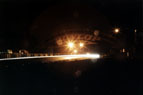 A shot of cars coming under the Dunlop Bridge.  As you can see from the pentagonal shaped flare, it was still raining!  (I think it's quite a good effect!)