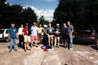 9 of the 12 1999 Tourists pose for yet another team picture in the car park at the back of the hotel at Le Grand Lucé.