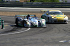 Lappery at Mulsanne Corner as Nicolas Minassian in the #17 Pescarolo passes the #85 Freisinger Porsche.