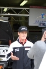 Patrick Long outside the IMSA Performance Porsche #76 garage