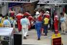 Tommy Erdos being pushed back into the #25 pit so that work can commence on the damaged car