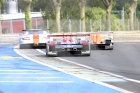 Audi waits to pass Aston and Lola.....