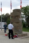 Ian looks at the recently-laid wreaths.