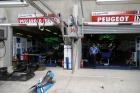 The Pescarolo pits.  To the left, the #16 Pescarolo of Tinseau, Jouanny and Barbosa (qualified 12th) and to the right, the Pescarolo Peugeot #17 of Boullion, Treluyer and Pagenaud which qualified 4th.