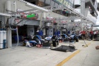 The most popular place in the pitlane?  I think so!  A view of the works Peugeot pits.