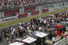 A general shot of the 'pretty people' milling around with the workers (the photographers and marshals) on the grid