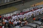 The start is getting ever nearer as the girls arrive on the grid with their position boards