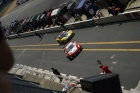 The Corvette #63 follows the Team Advanced Engineering Ferrari #81 into the pits