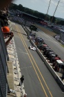 The #7 Aston Martin Racing Lola enters the pits.....