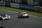 #009 Lola passes the AF Corse Ferrari #78