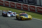 The RML Lola #25 shapes up to pass the #63 Corvette on the straight